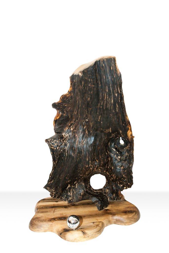 `Handcrafted walnut lamp with an organic sculptural design by DIA Dream Design